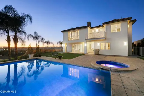 a front view of a house with swimming pool