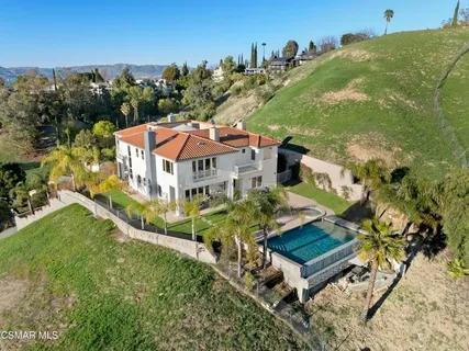 an aerial view of a house with a garden