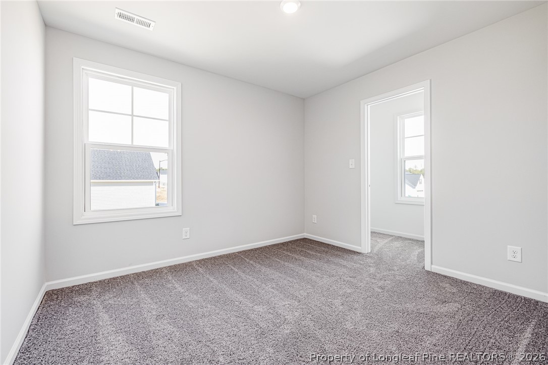 5413 Short Leaf Road Fayetteville, NC 28311 - Photo 11 of 33 an empty room with windows