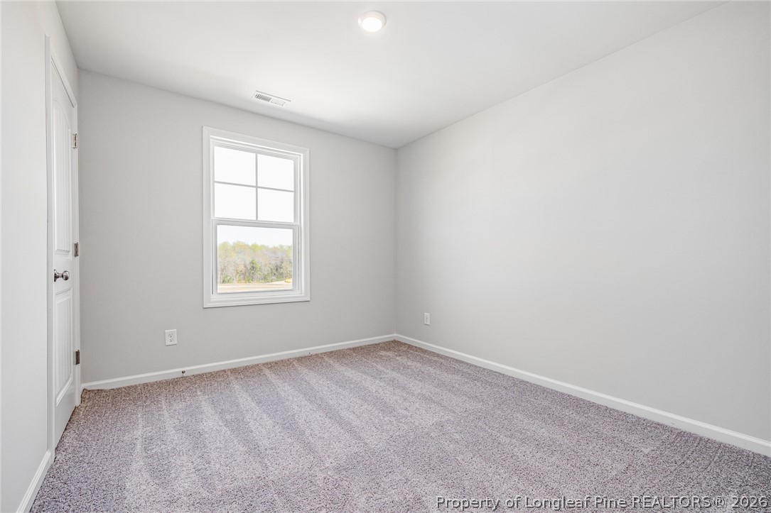 5413 Short Leaf Road Fayetteville, NC 28311 - Photo 15 of 33 an empty room with windows