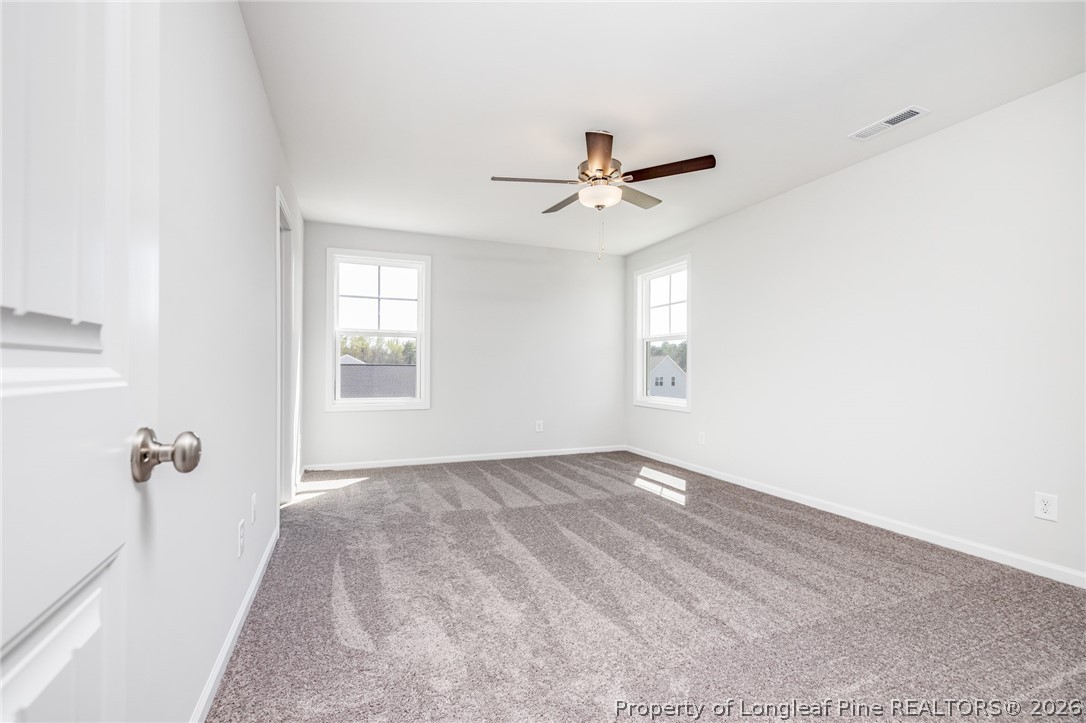 5413 Short Leaf Road Fayetteville, NC 28311 - Photo 19 of 33 a view of a livingroom with a ceiling fan and window