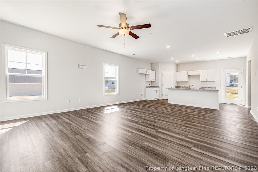 5413 Short Leaf Road Fayetteville, NC 28311 - Photo 2 of 33 a view of a kitchen with a sink and wooden floor