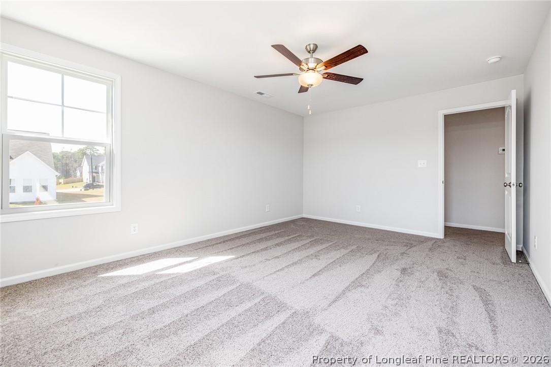 5413 Short Leaf Road Fayetteville, NC 28311 - Photo 22 of 33 an empty room with windows and fan