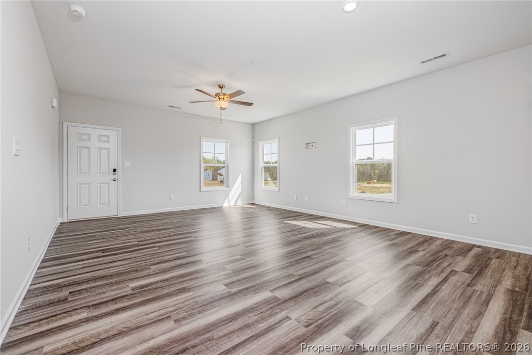 5413 Short Leaf Road Fayetteville, NC 28311 - Photo 4 of 33 wooden floor in an empty room with a window