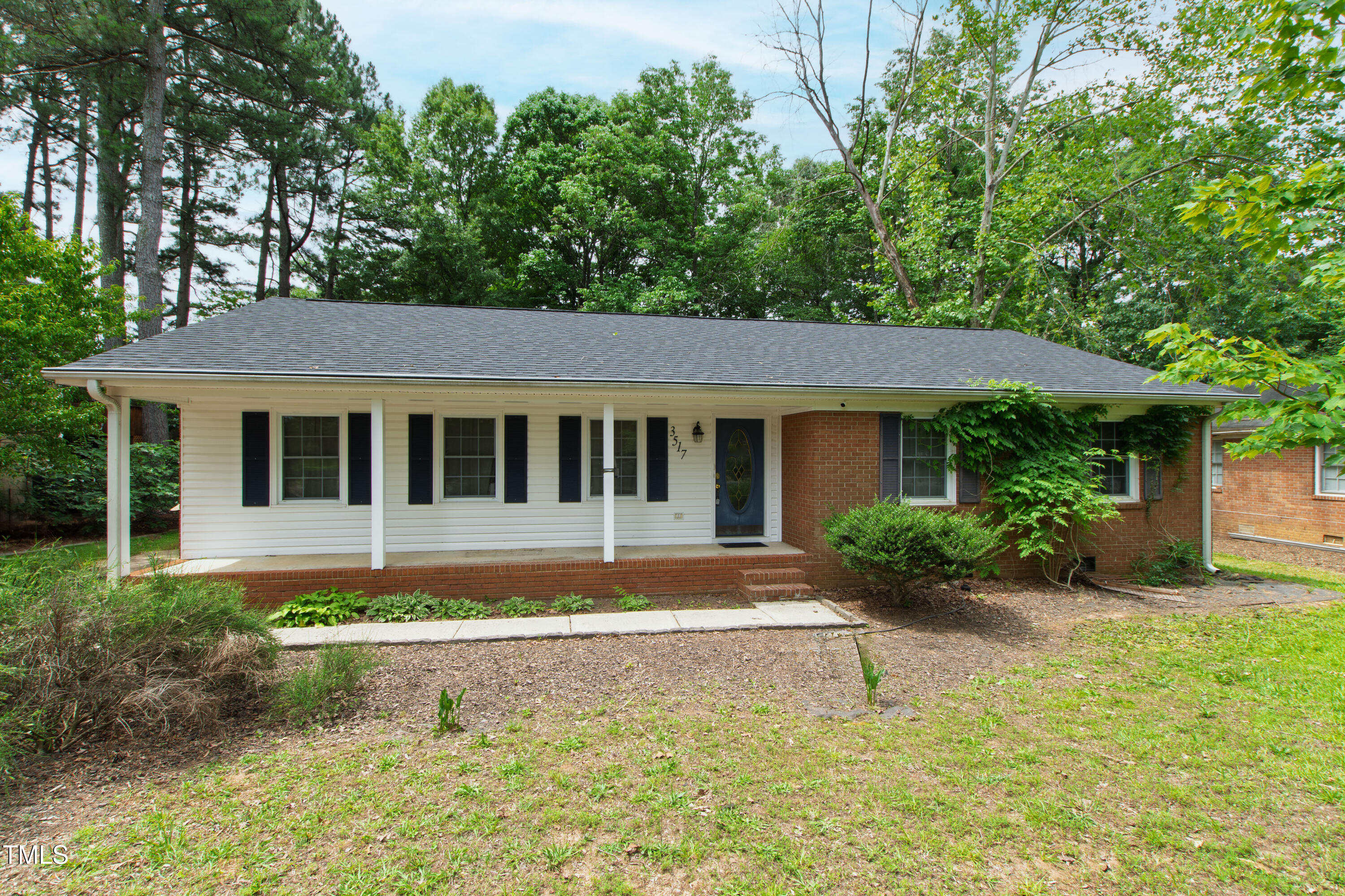 3517 Morningside Drive Raleigh, NC 27607 - Photo 3 of 9 a front view of a house with a yard