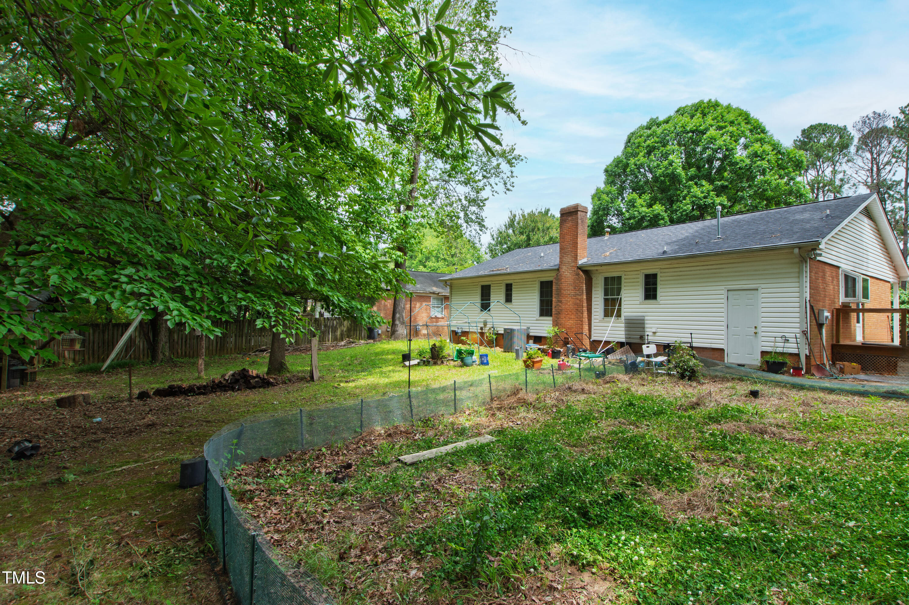 3517 Morningside Drive Raleigh, NC 27607 - Photo 5 of 9 a view of a house with backyard and sitting area