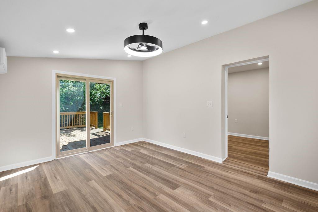 175 McMurray Road Pittsburgh, PA 15241 - Photo 14 of 45 an empty room with wooden floor and windows