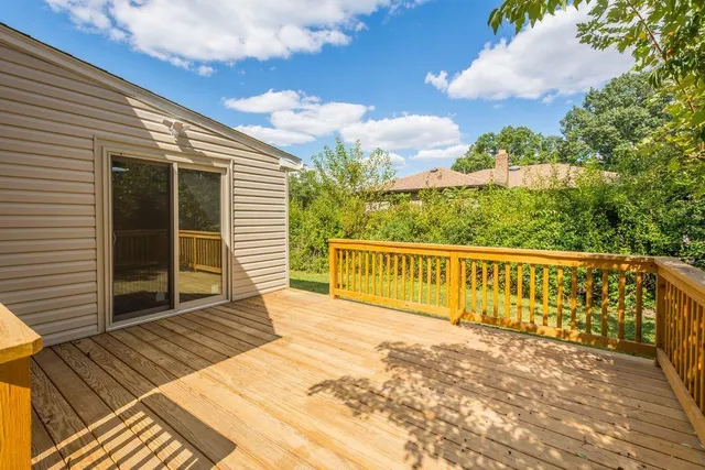 a view of a wooden balcony with a sink