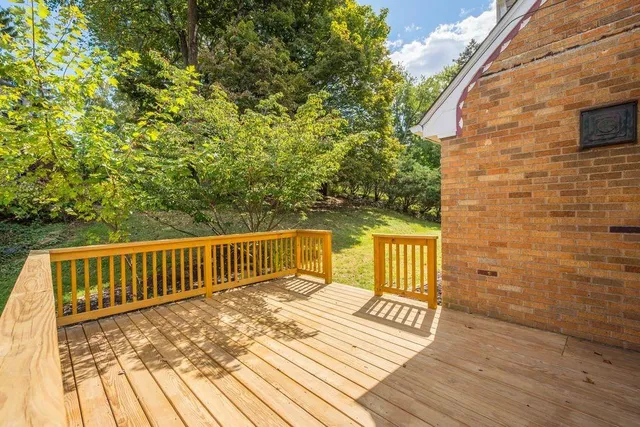 a view of deck with two chair and wooden floor