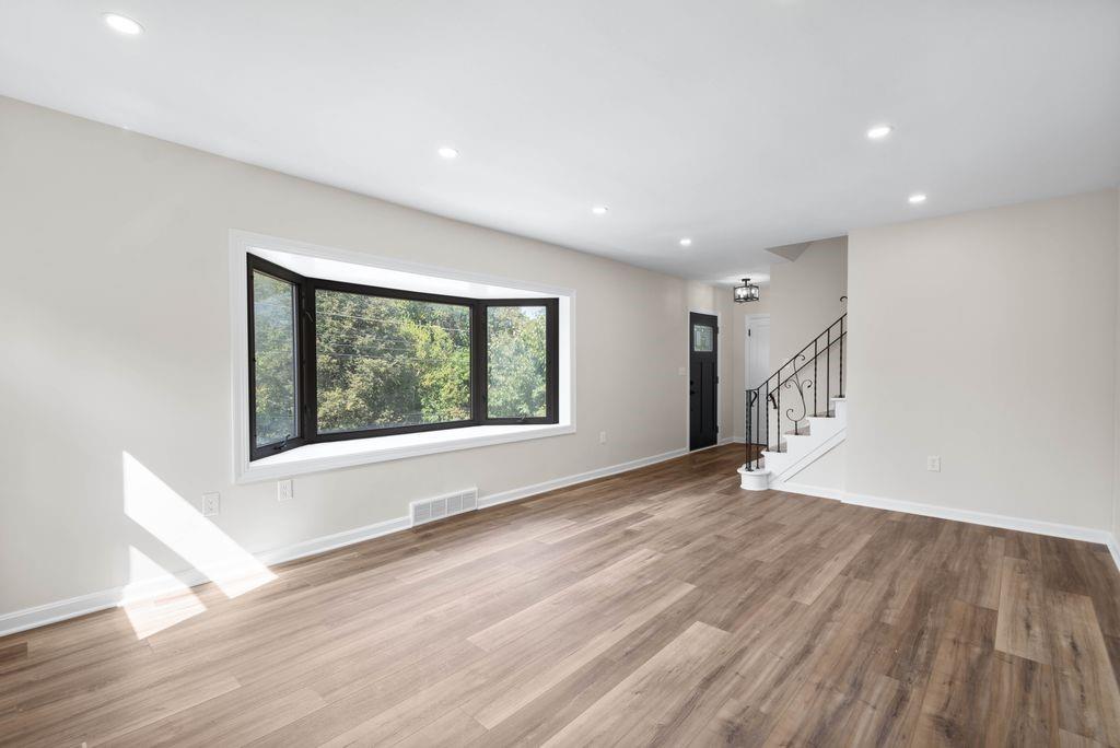 175 McMurray Road Pittsburgh, PA 15241 - Photo 3 of 45 a view of an empty room with wooden floor and a window