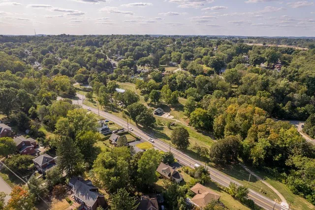 an aerial view of a house with a yard