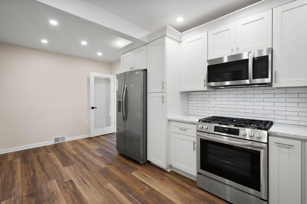 175 McMurray Road Pittsburgh, PA 15241 - Photo 8 of 45 a kitchen with stainless steel appliances a stove microwave and refrigerator