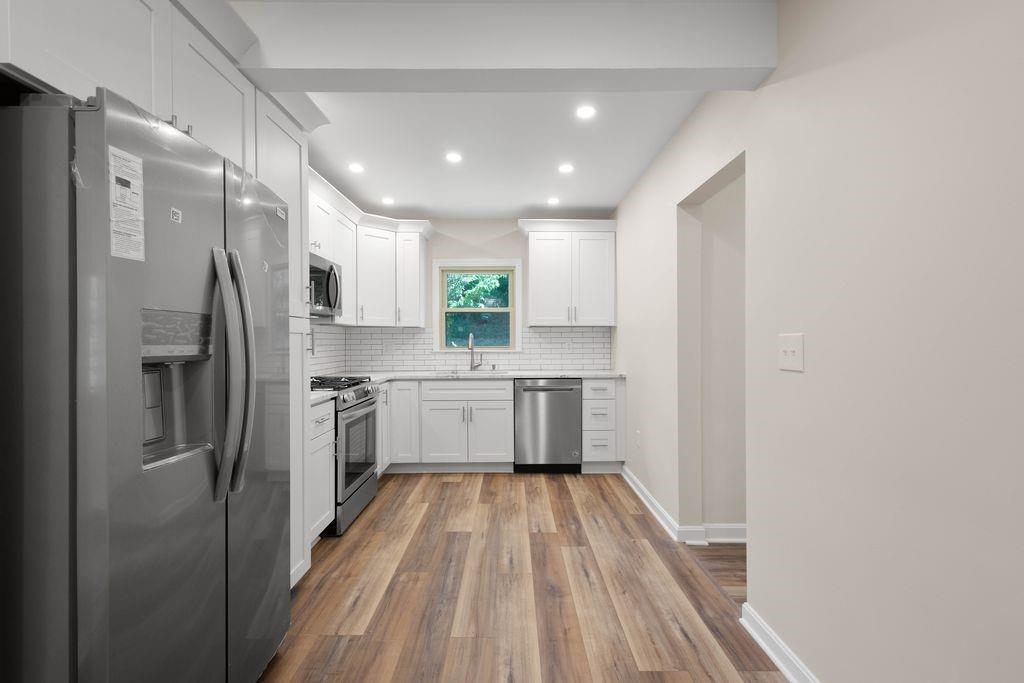 175 McMurray Road Pittsburgh, PA 15241 - Photo 9 of 45 a kitchen with white cabinets stainless steel appliances and sink