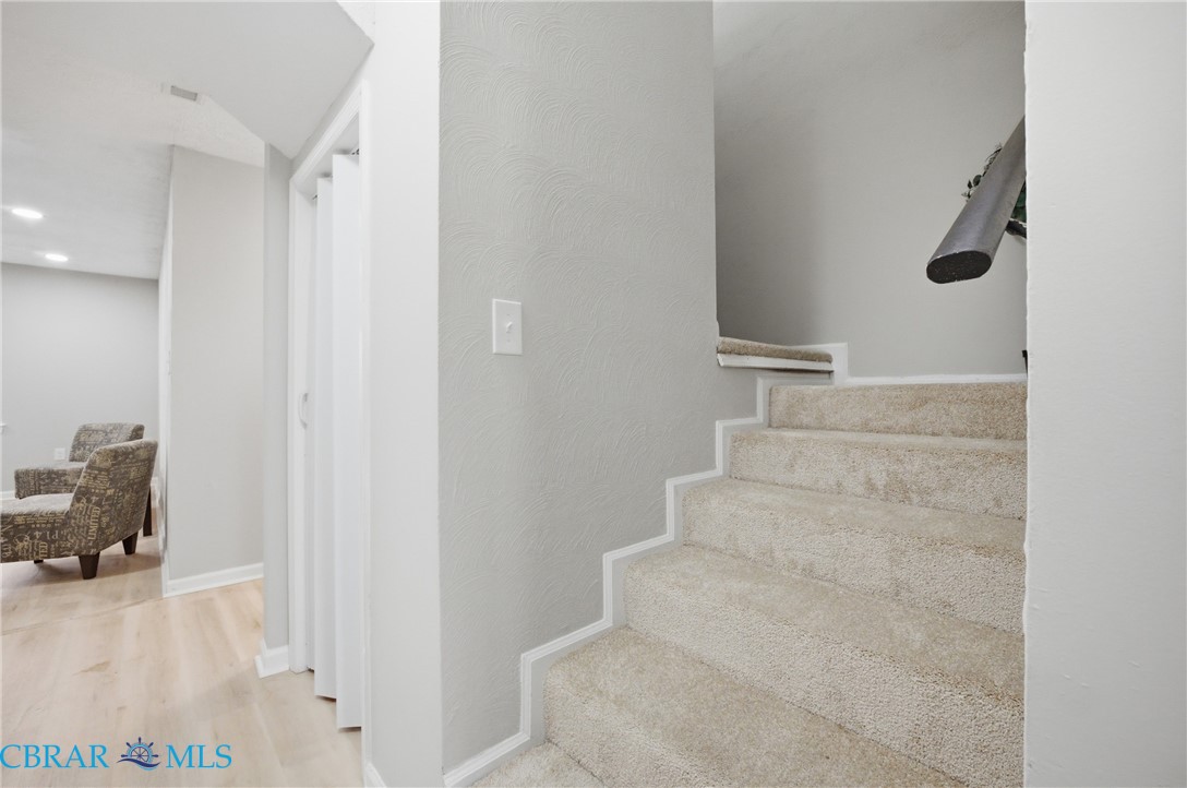 733 Spruce Street Hampton, VA 23661 - Photo 12 of 29 Staircase featuring wood finished floors and baseboards