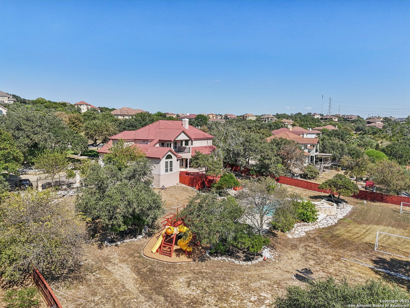 718 Ruidosa Downs Helotes, TX 78023 - Photo 20 of 50 an aerial view of a house with a garden