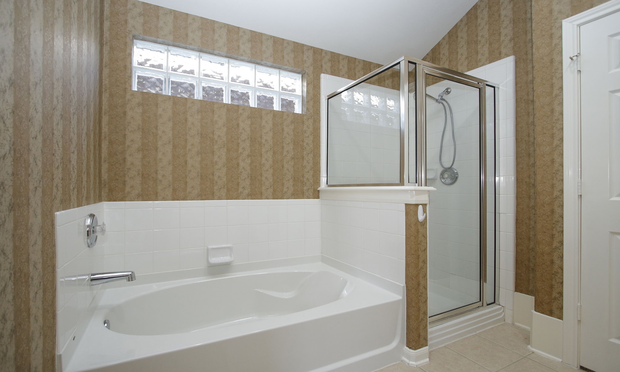 2818 Crescent Star Road Spring, TX 77388 - Photo 11 of 20 a bathroom with a bathtub and a shower