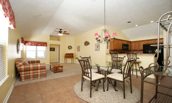 a view of a dining room with furniture