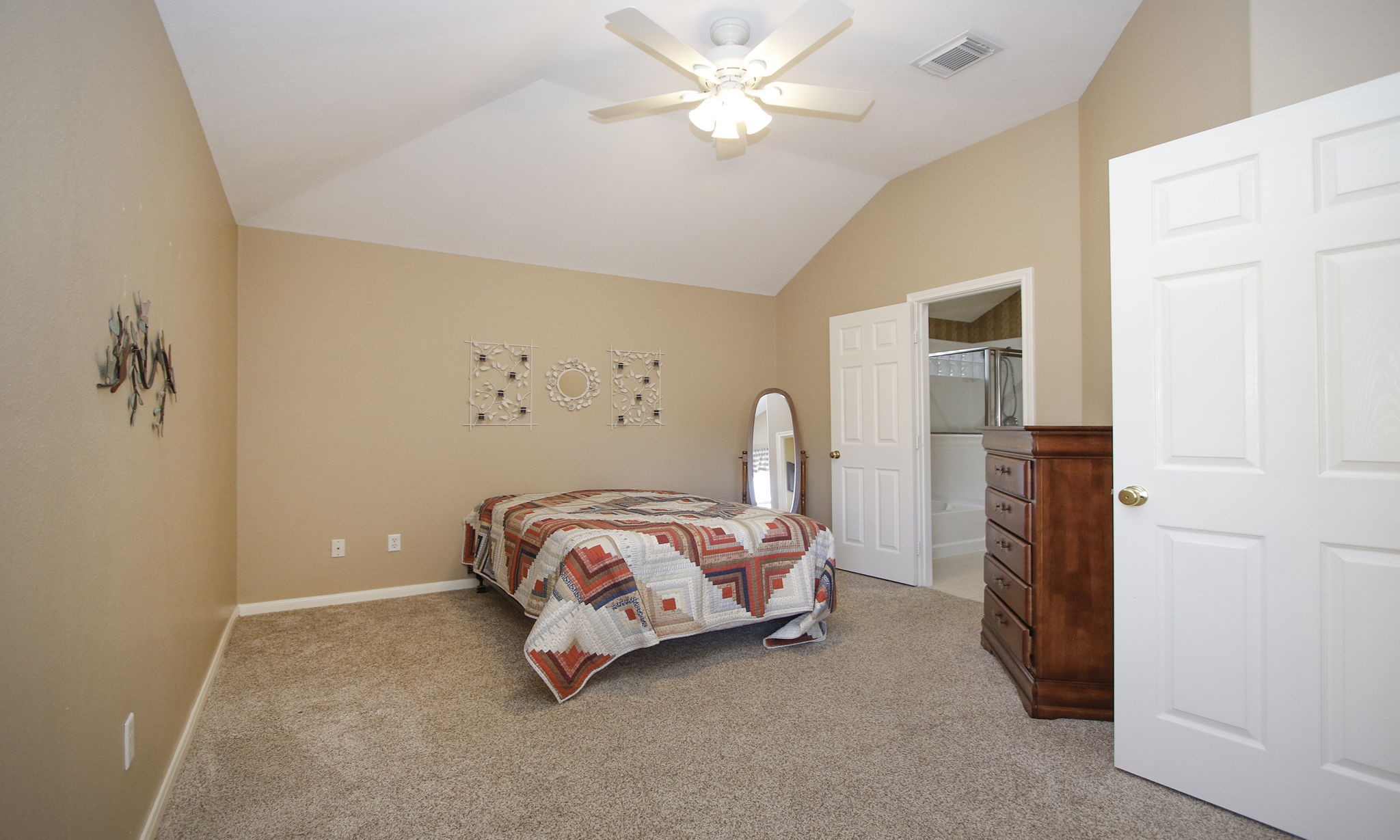 2818 Crescent Star Road Spring, TX 77388 - Photo 9 of 20 a bedroom with bed and a chandelier