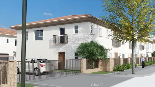 a view of multiple houses with a street