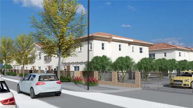 a car parked in front of a white house