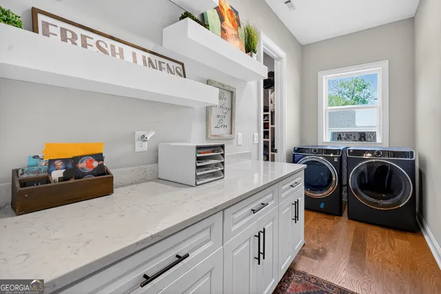 a kitchen with sink and cabinets