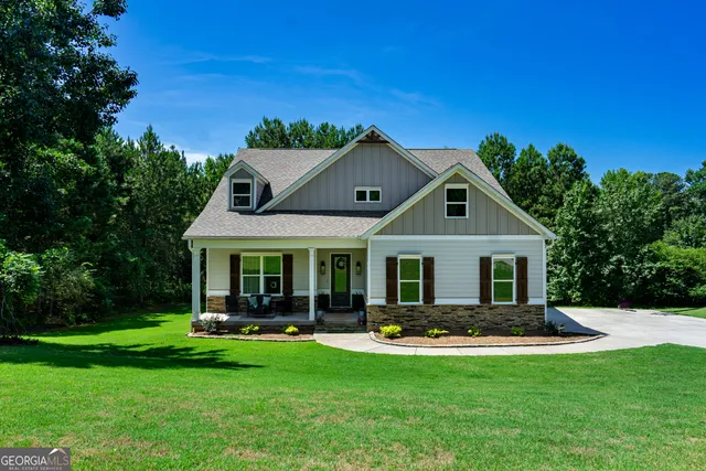 a front view of house with yard and outdoor seating