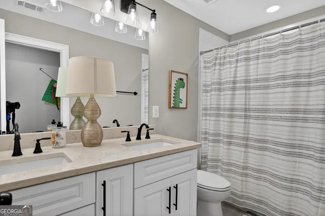 a view of a livingroom with furniture and a flat screen tv