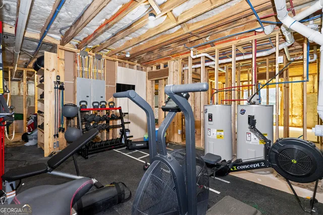 a bedroom with furniture and a large window