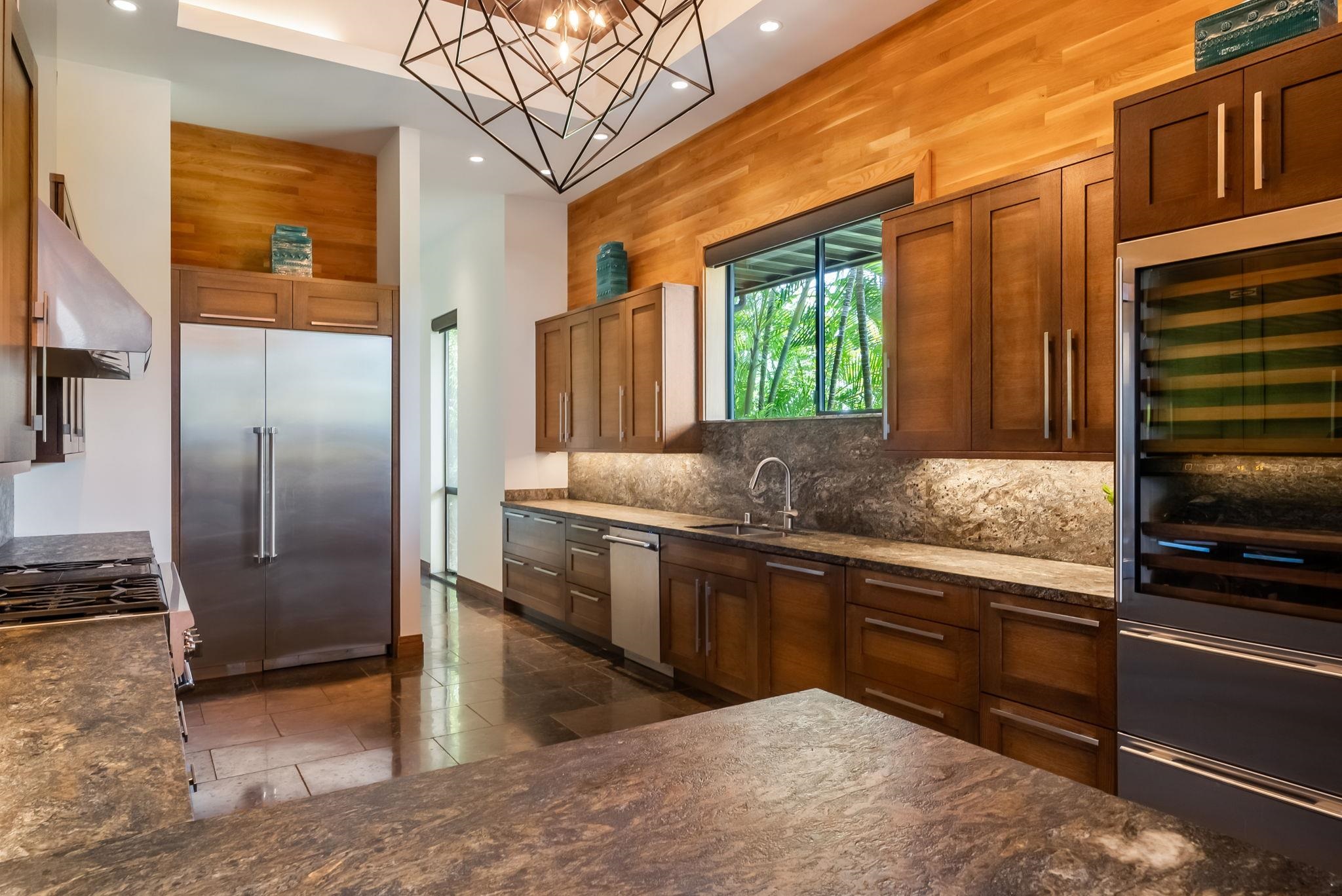 860 South Kihei Road Kihei, HI 96753 - Photo 13 of 49 a kitchen with stainless steel appliances granite countertop a sink and a refrigerator
