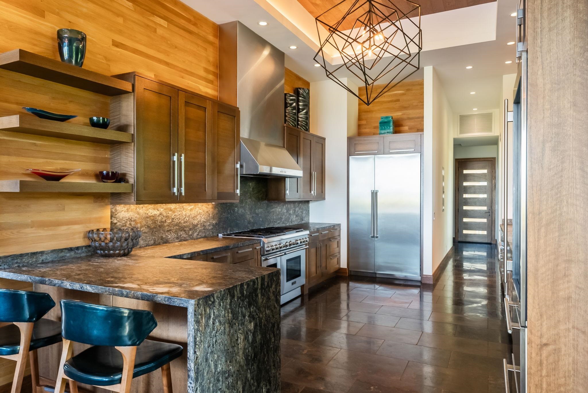 860 South Kihei Road Kihei, HI 96753 - Photo 14 of 49 a kitchen with stainless steel appliances granite countertop a sink and a refrigerator