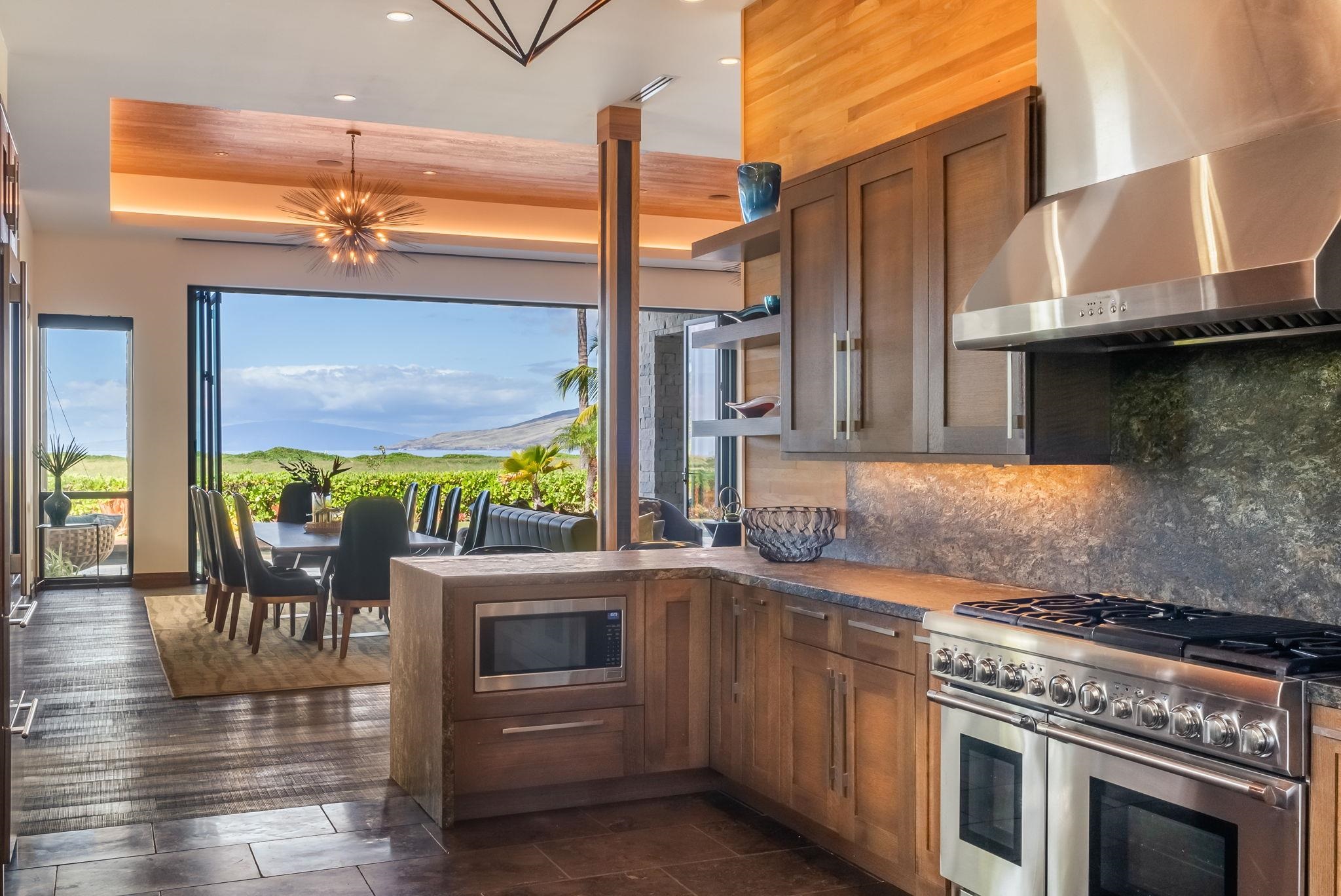 860 South Kihei Road Kihei, HI 96753 - Photo 15 of 49 a kitchen with stainless steel appliances granite countertop a stove a sink and a microwave