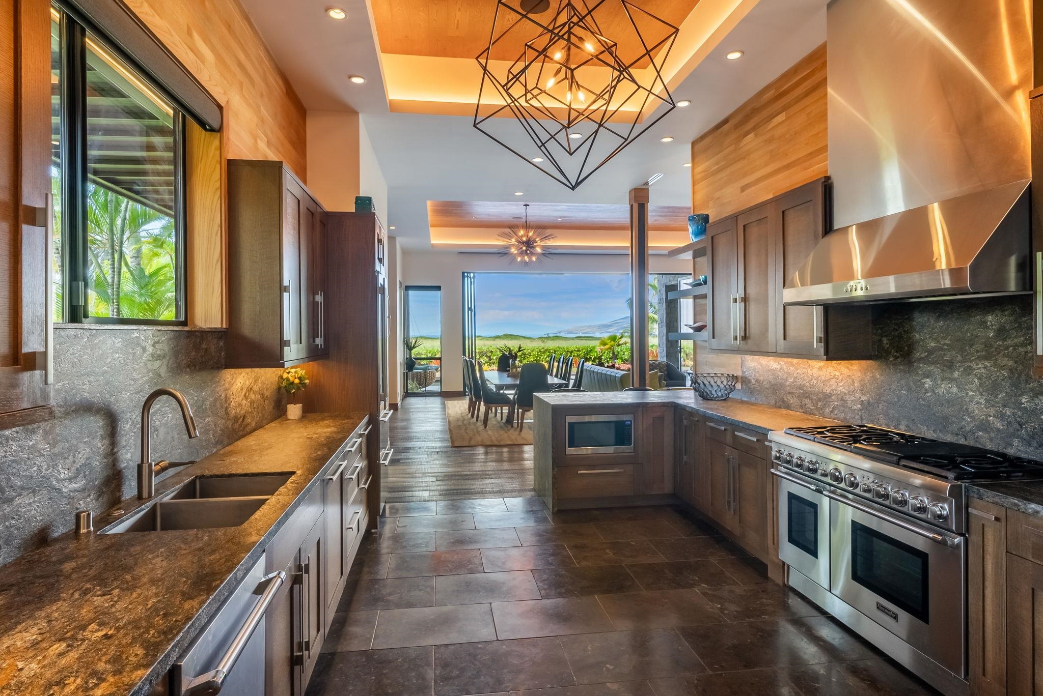 860 South Kihei Road Kihei, HI 96753 - Photo 16 of 49 a kitchen with stainless steel appliances granite countertop a stove a sink and a microwave