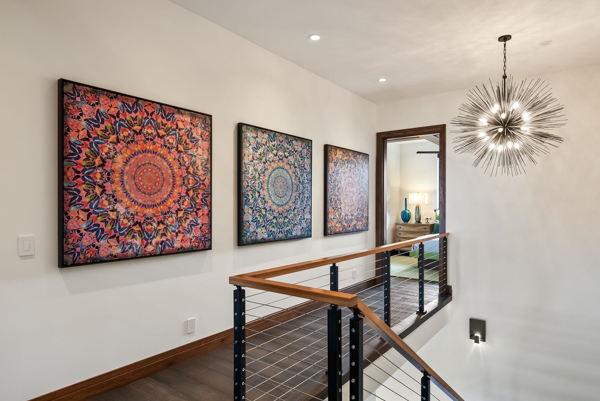 860 South Kihei Road Kihei, HI 96753 - Photo 18 of 49 a view of a hallway with paintings on the wall and table