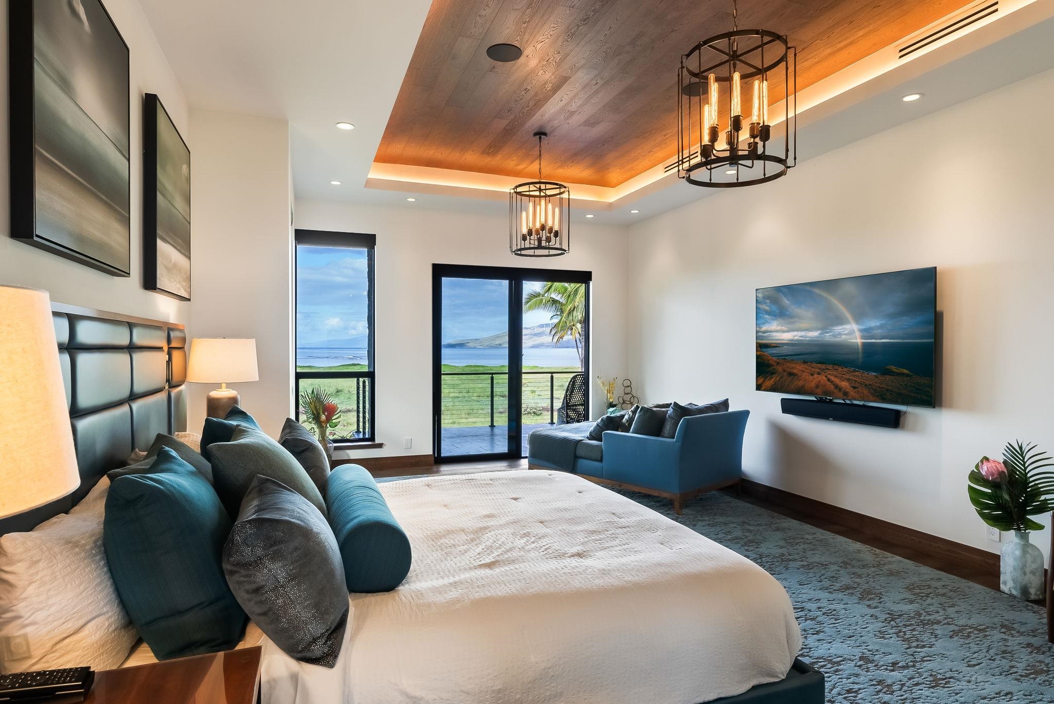 860 South Kihei Road Kihei, HI 96753 - Photo 20 of 49 a bedroom with furniture and a flat screen tv