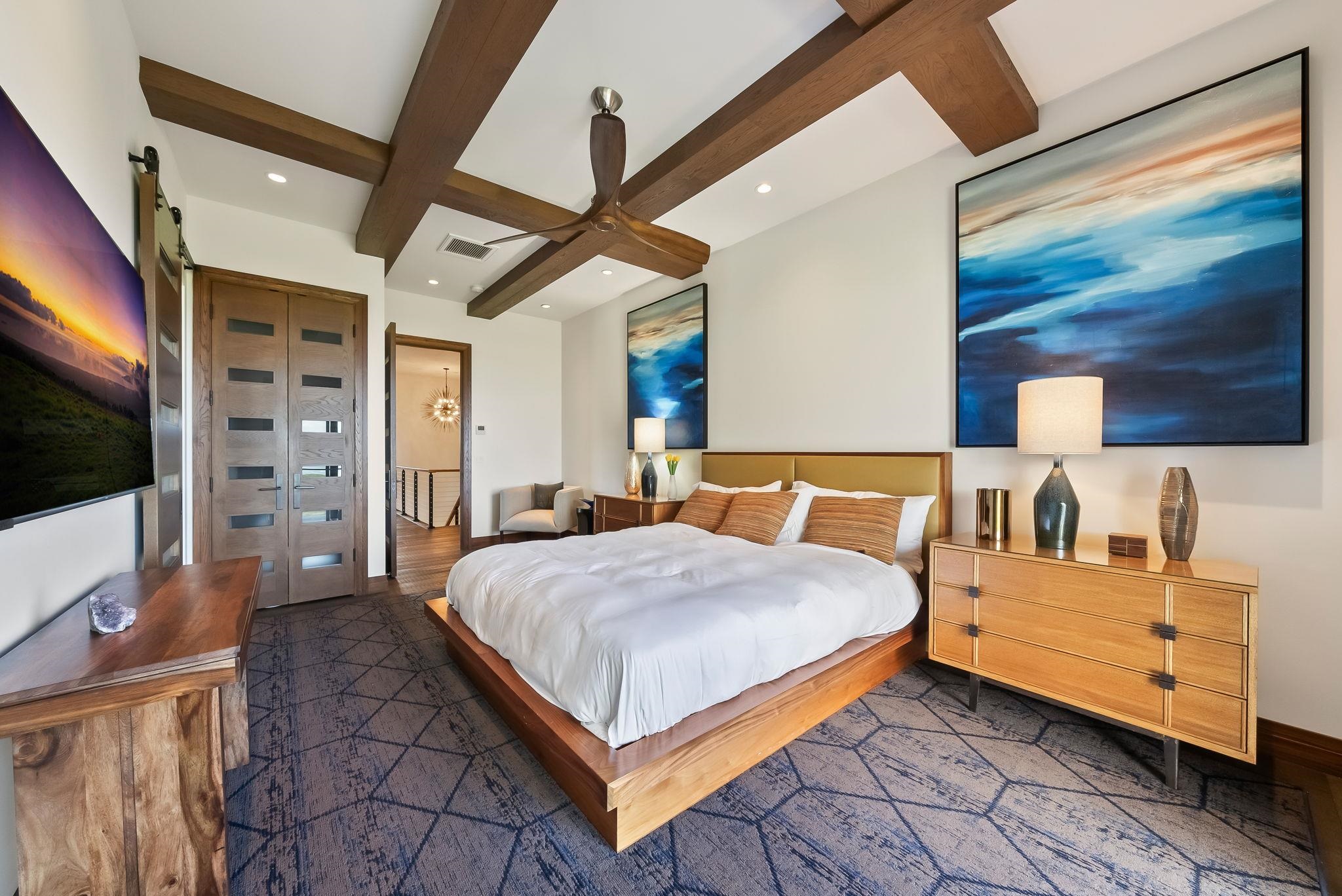 860 South Kihei Road Kihei, HI 96753 - Photo 28 of 49 a bedroom with a bed and a flat screen tv