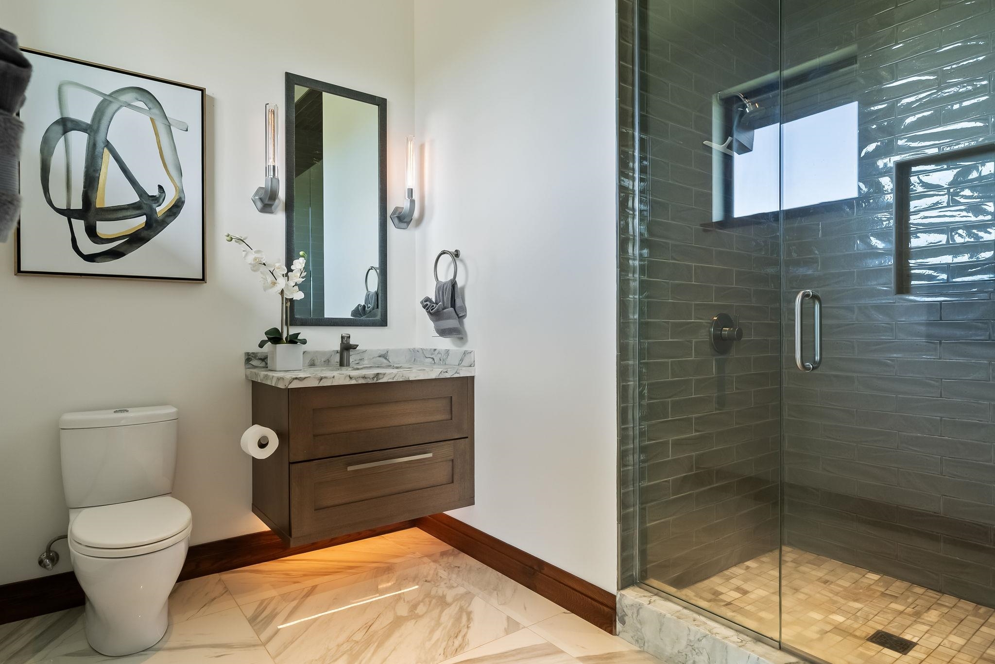 860 South Kihei Road Kihei, HI 96753 - Photo 40 of 49 a bathroom with a toilet sink vanity and mirror