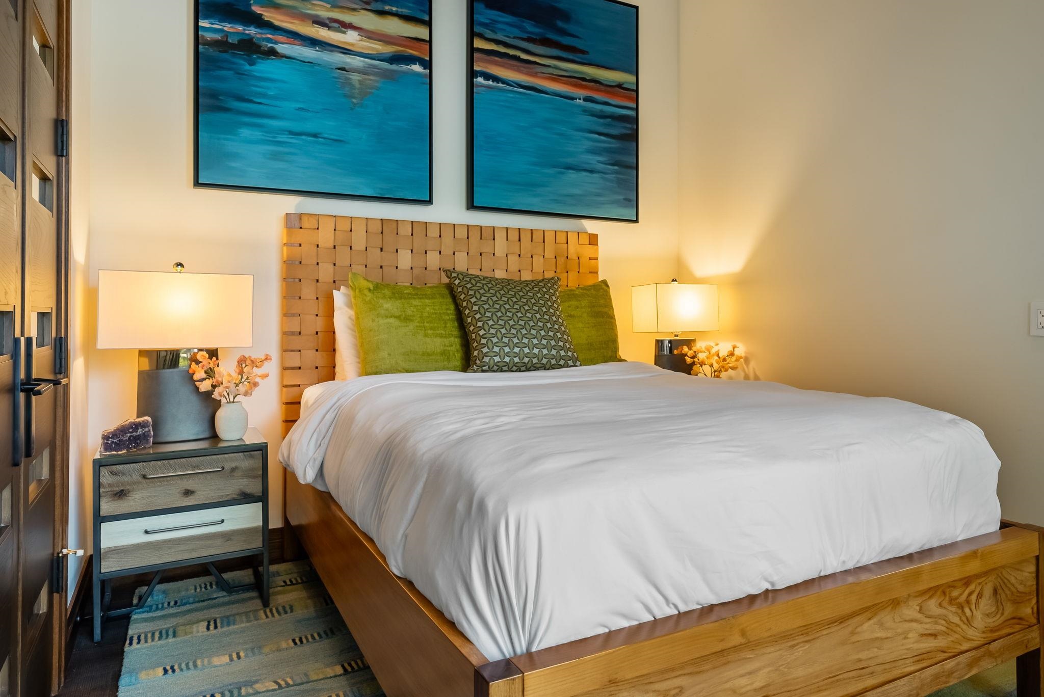 860 South Kihei Road Kihei, HI 96753 - Photo 42 of 49 a bedroom with a bed and wooden floor