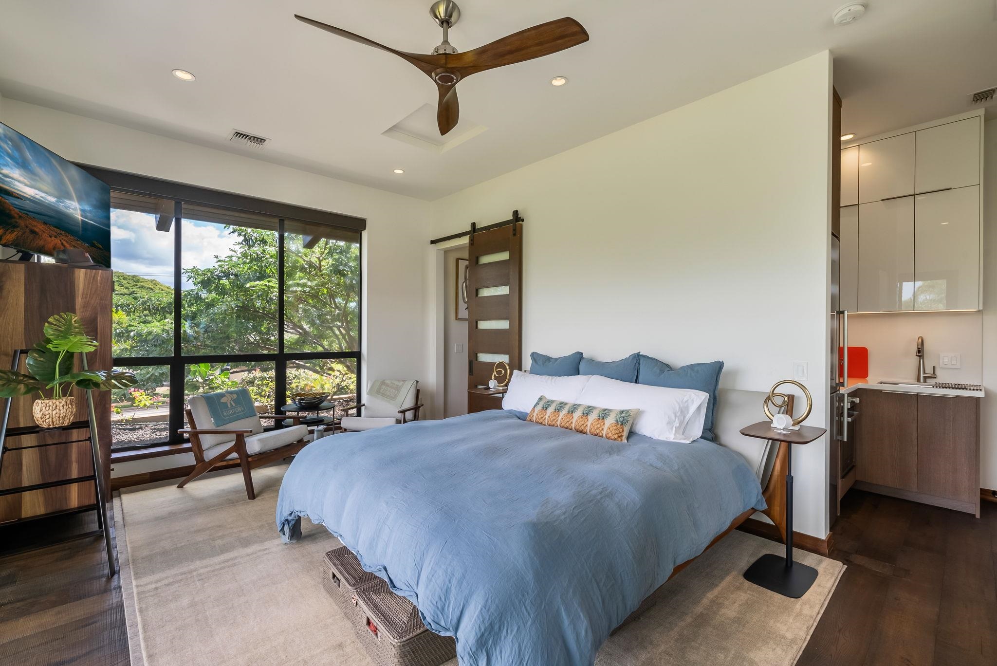 860 South Kihei Road Kihei, HI 96753 - Photo 47 of 49 a bedroom with a bed and large windows