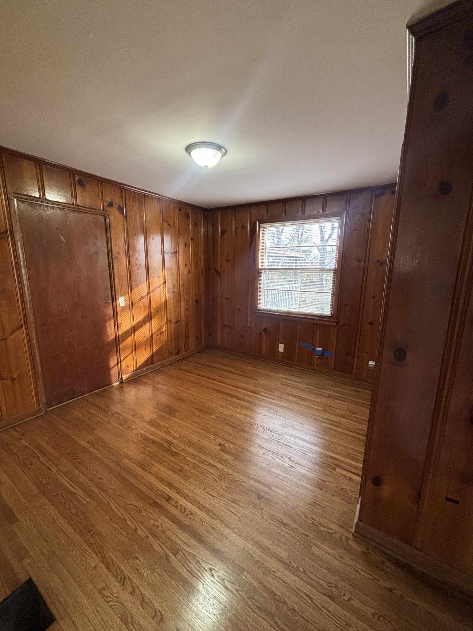 4010 Tucker Road Nashville, TN 37218 - Photo 9 of 13 an empty room with wooden floor and windows