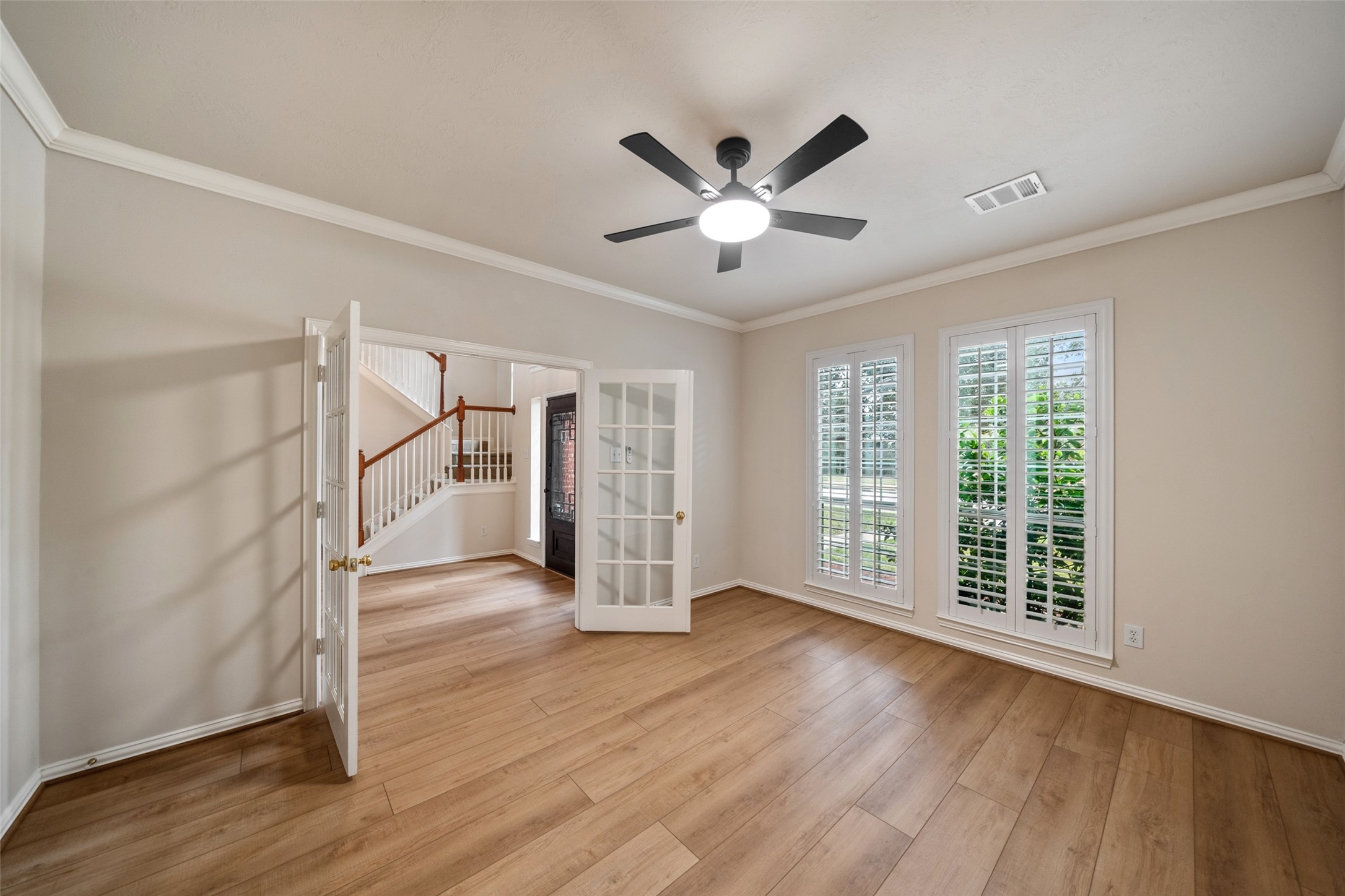 14803 Ramblebrook Humble, TX 77396 - Photo 16 of 45 a view of empty room with wooden floor and fan