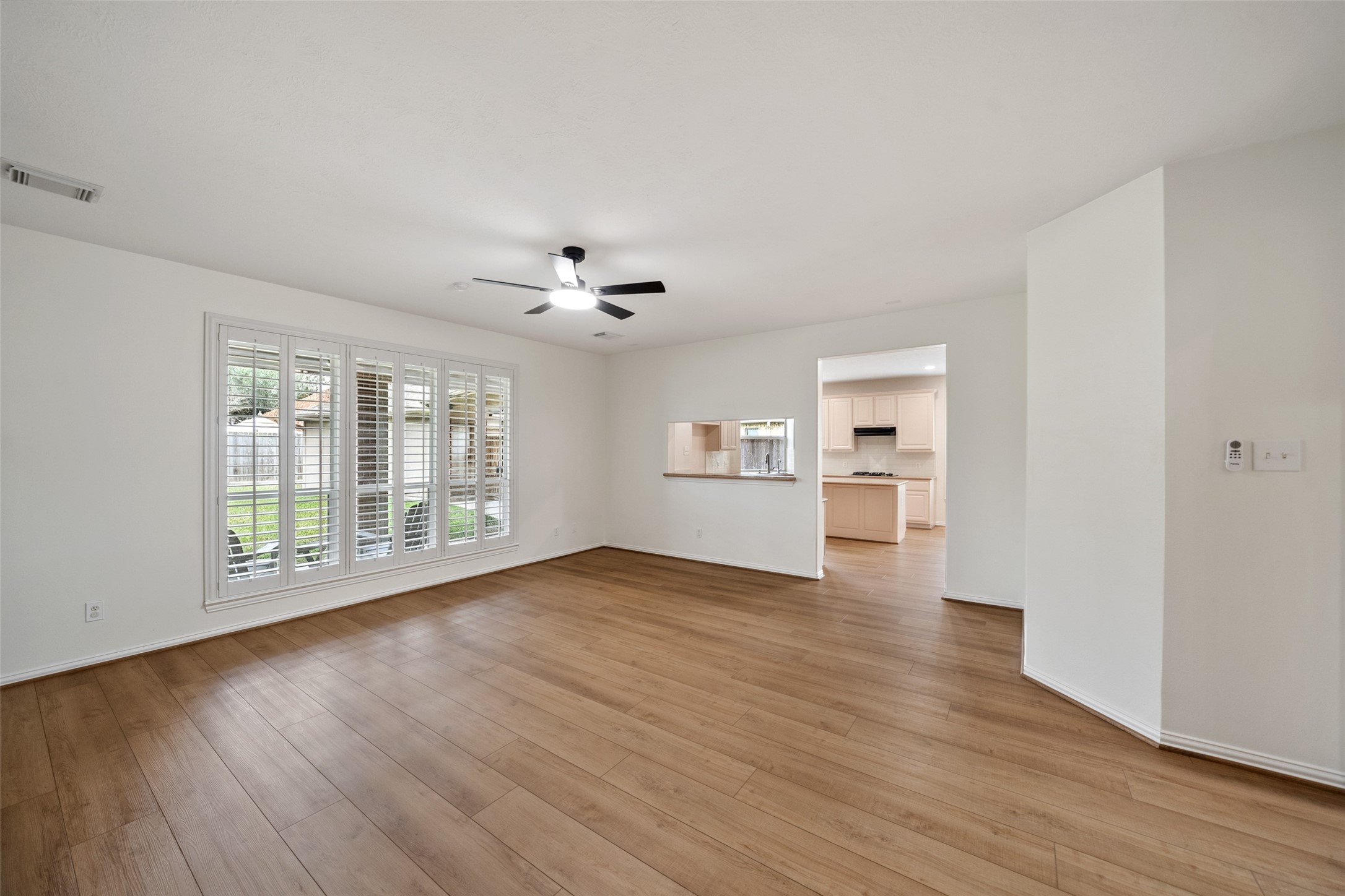 14803 Ramblebrook Humble, TX 77396 - Photo 19 of 45 a view of empty room with wooden floor and fan