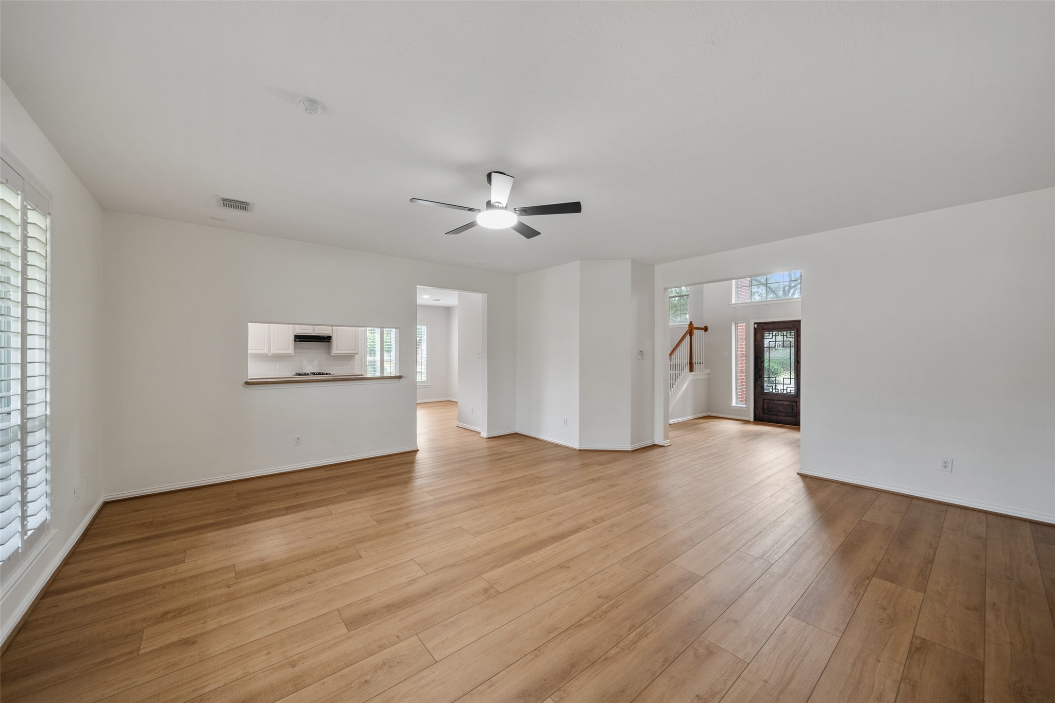 14803 Ramblebrook Humble, TX 77396 - Photo 20 of 45 wooden floor in an empty room with a window