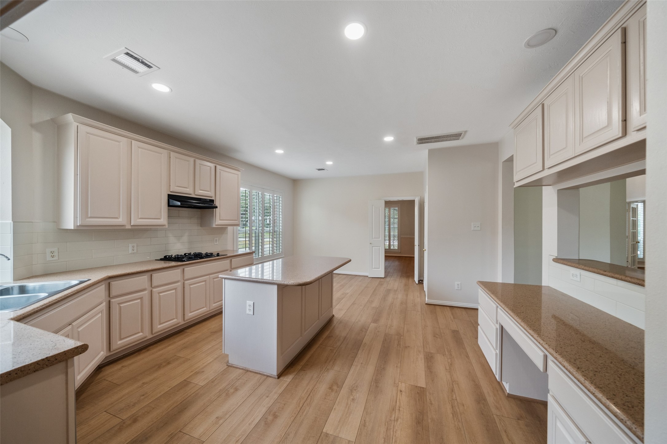 14803 Ramblebrook Humble, TX 77396 - Photo 22 of 45 a large kitchen with stainless steel appliances lots of counter space and wooden floor