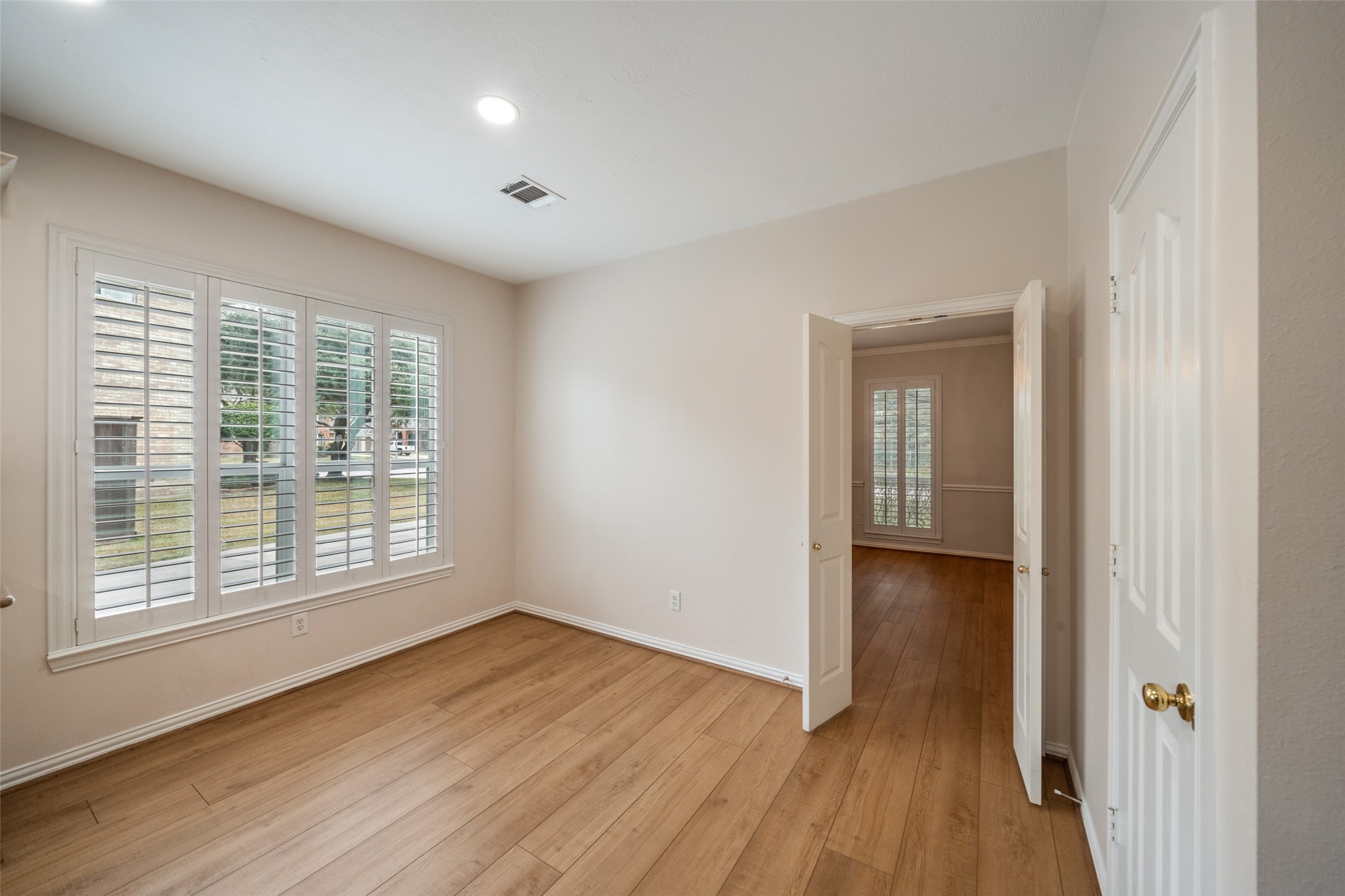 14803 Ramblebrook Humble, TX 77396 - Photo 24 of 45 a view of an empty room with wooden floor and a window