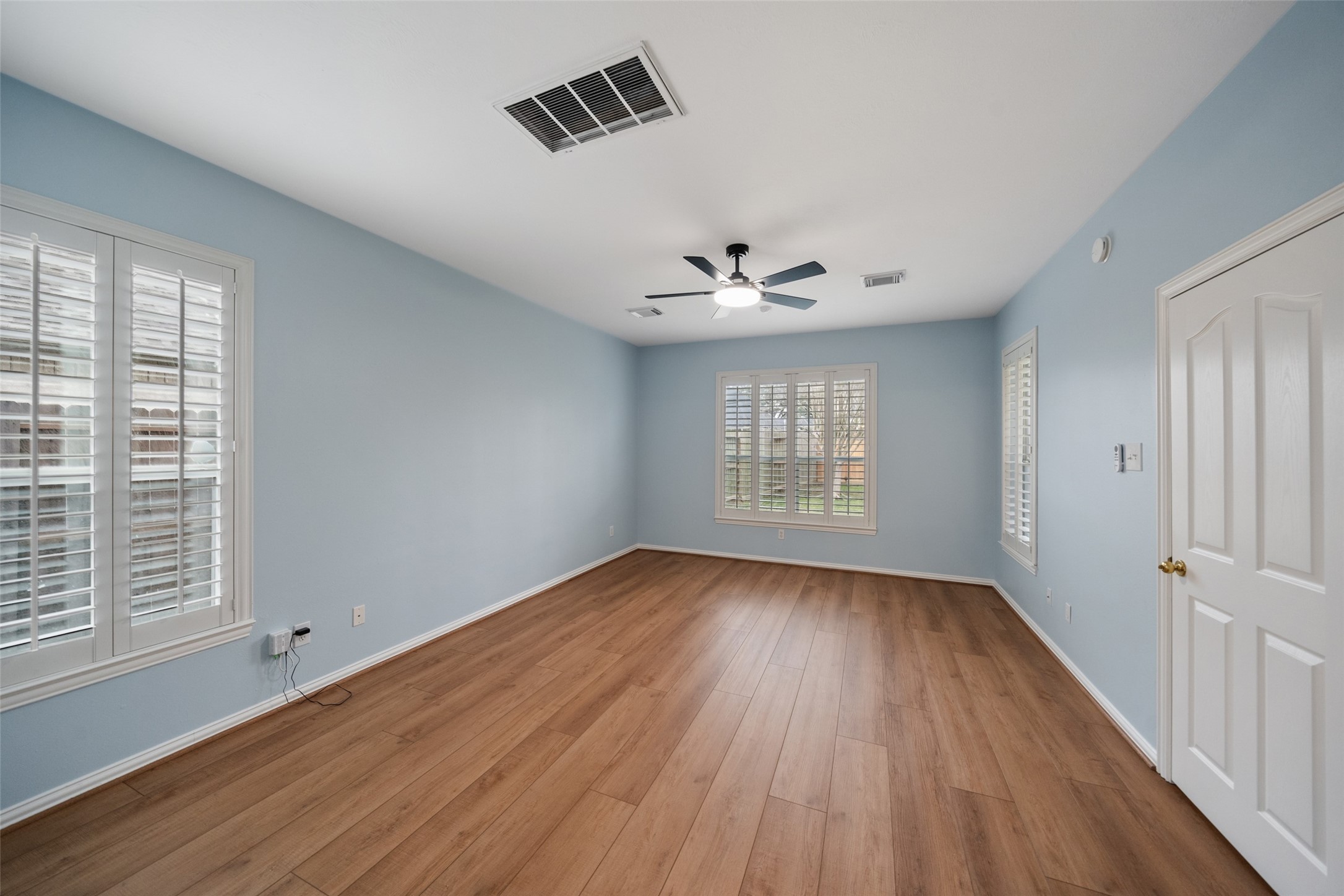 14803 Ramblebrook Humble, TX 77396 - Photo 25 of 45 a view of an empty room with wooden floor and a window