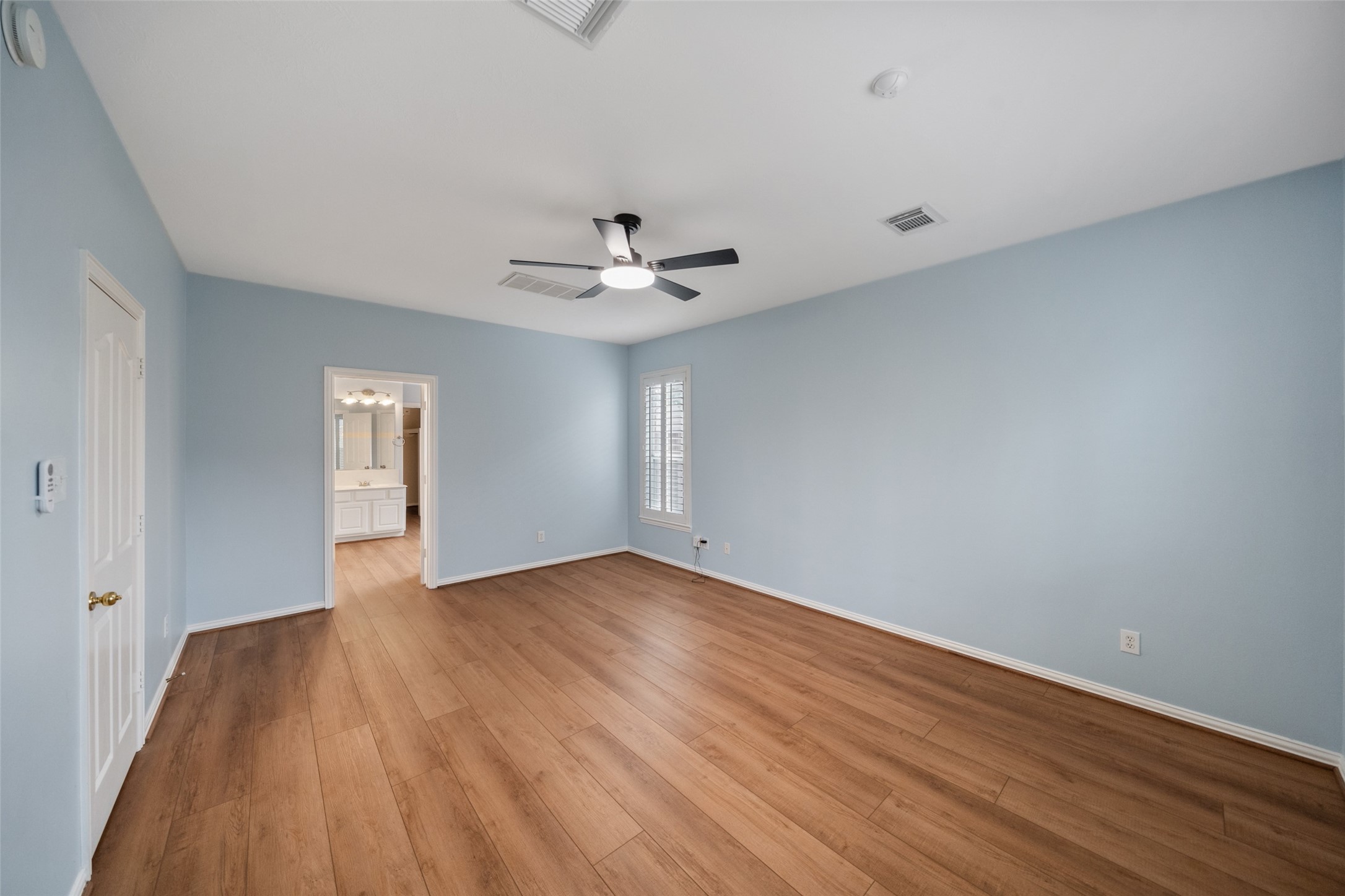 14803 Ramblebrook Humble, TX 77396 - Photo 26 of 45 a view of an empty room with wooden floor