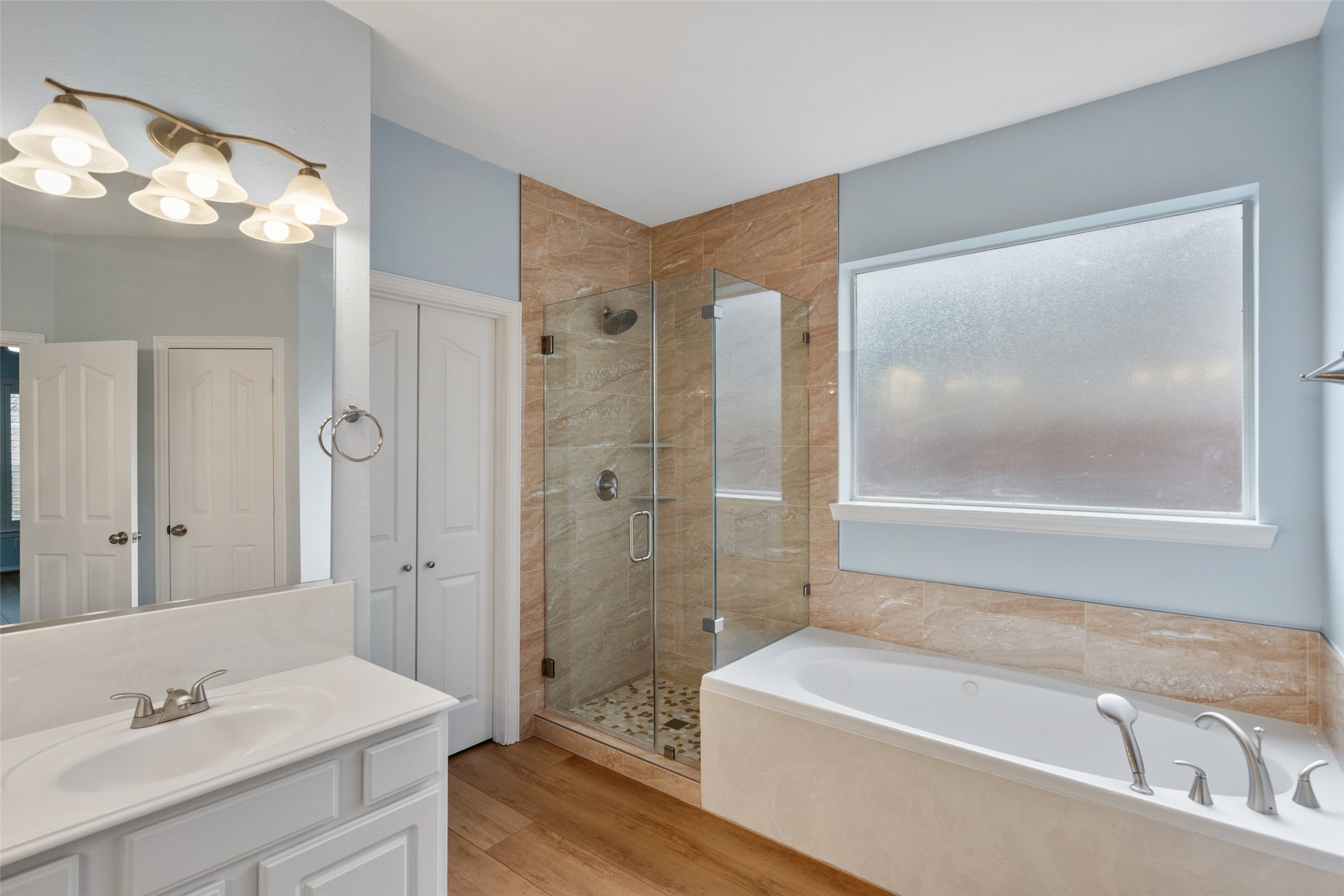 14803 Ramblebrook Humble, TX 77396 - Photo 27 of 45 a bathroom with a tub a sink and mirror