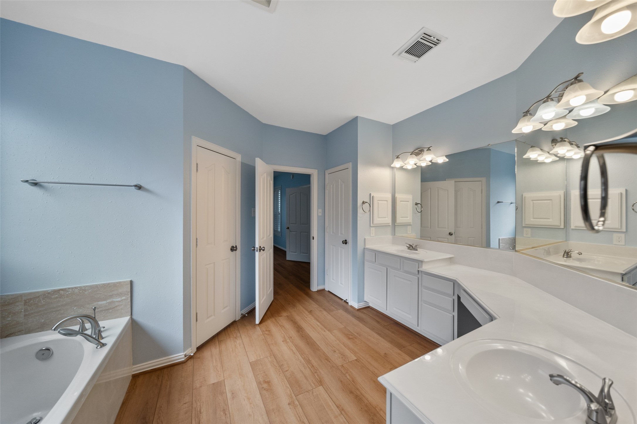 14803 Ramblebrook Humble, TX 77396 - Photo 28 of 45 a large bathroom with a double vanity sink mirror and shower