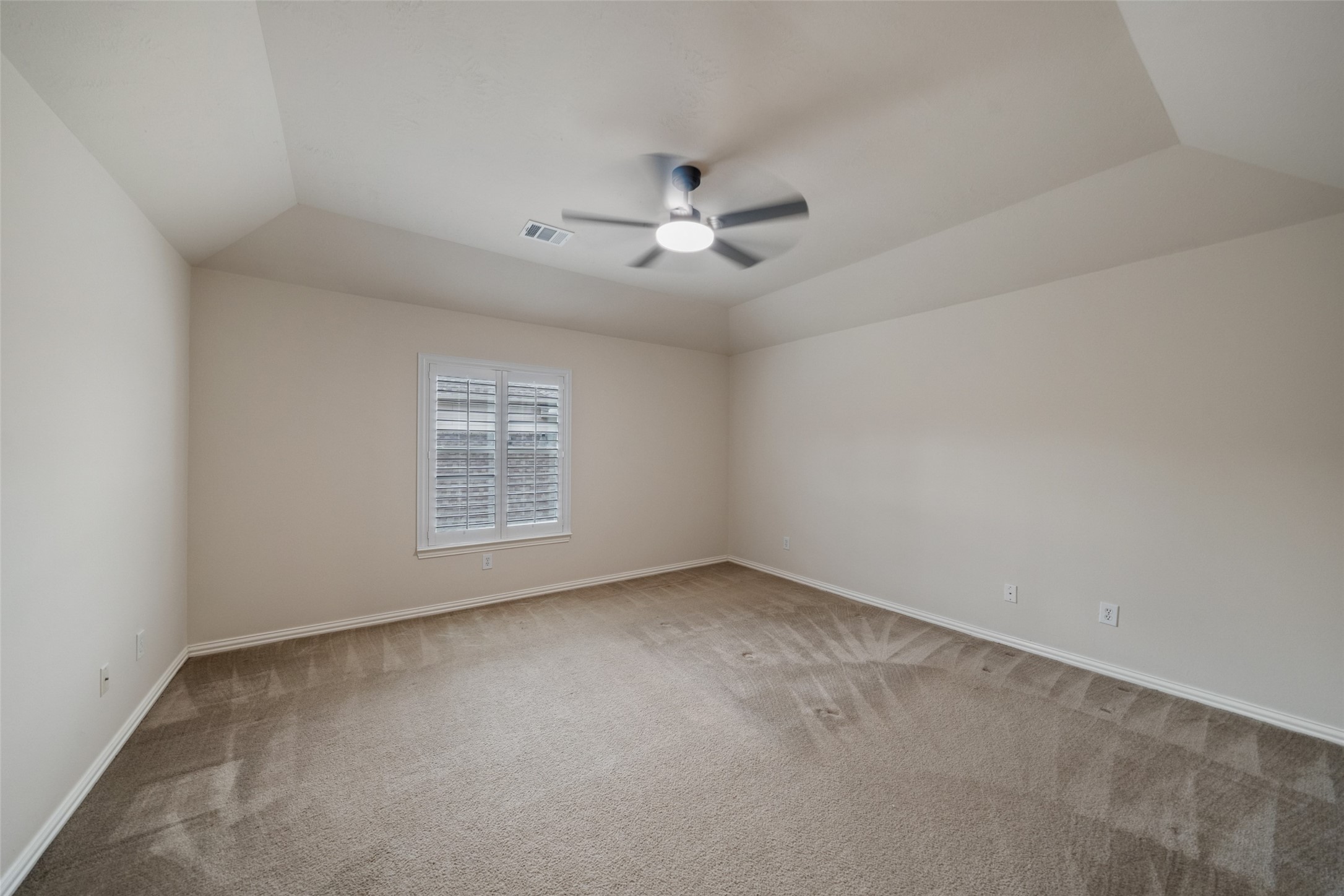 14803 Ramblebrook Humble, TX 77396 - Photo 33 of 45 an empty room with a window and a ceiling fan