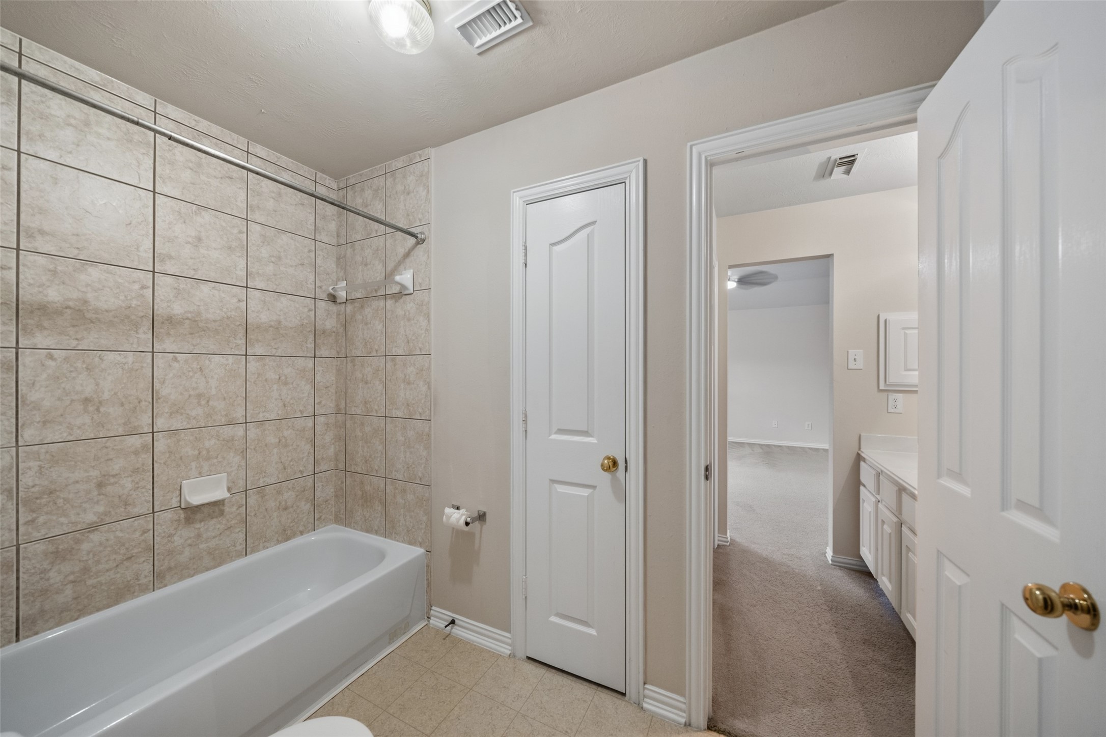 14803 Ramblebrook Humble, TX 77396 - Photo 37 of 45 a bathroom with a bathtub and shower